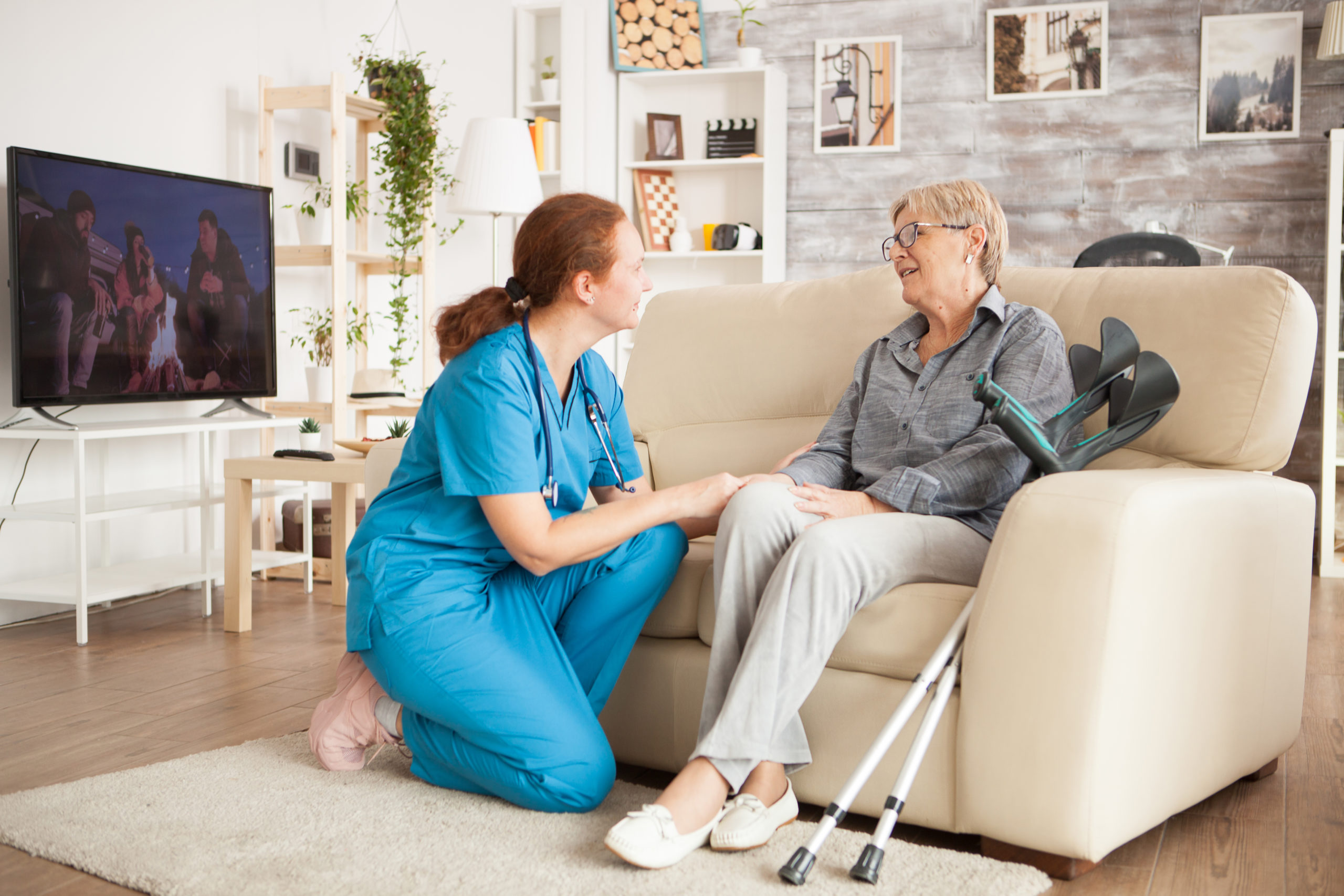 Young female nurse wearing blue uniform property management service